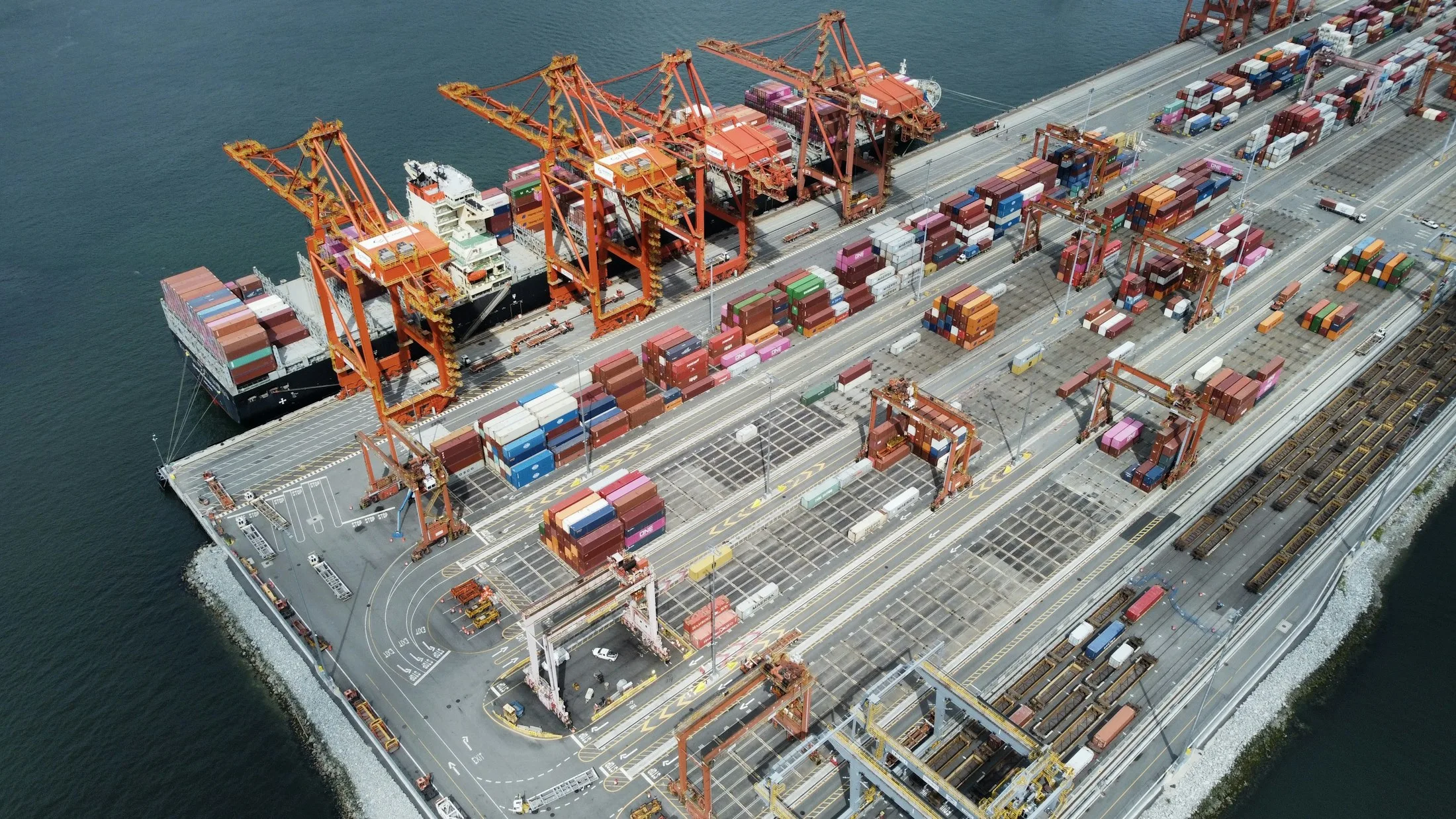 Container terminal with a vessel, gantry cranes and stacked freight containers
