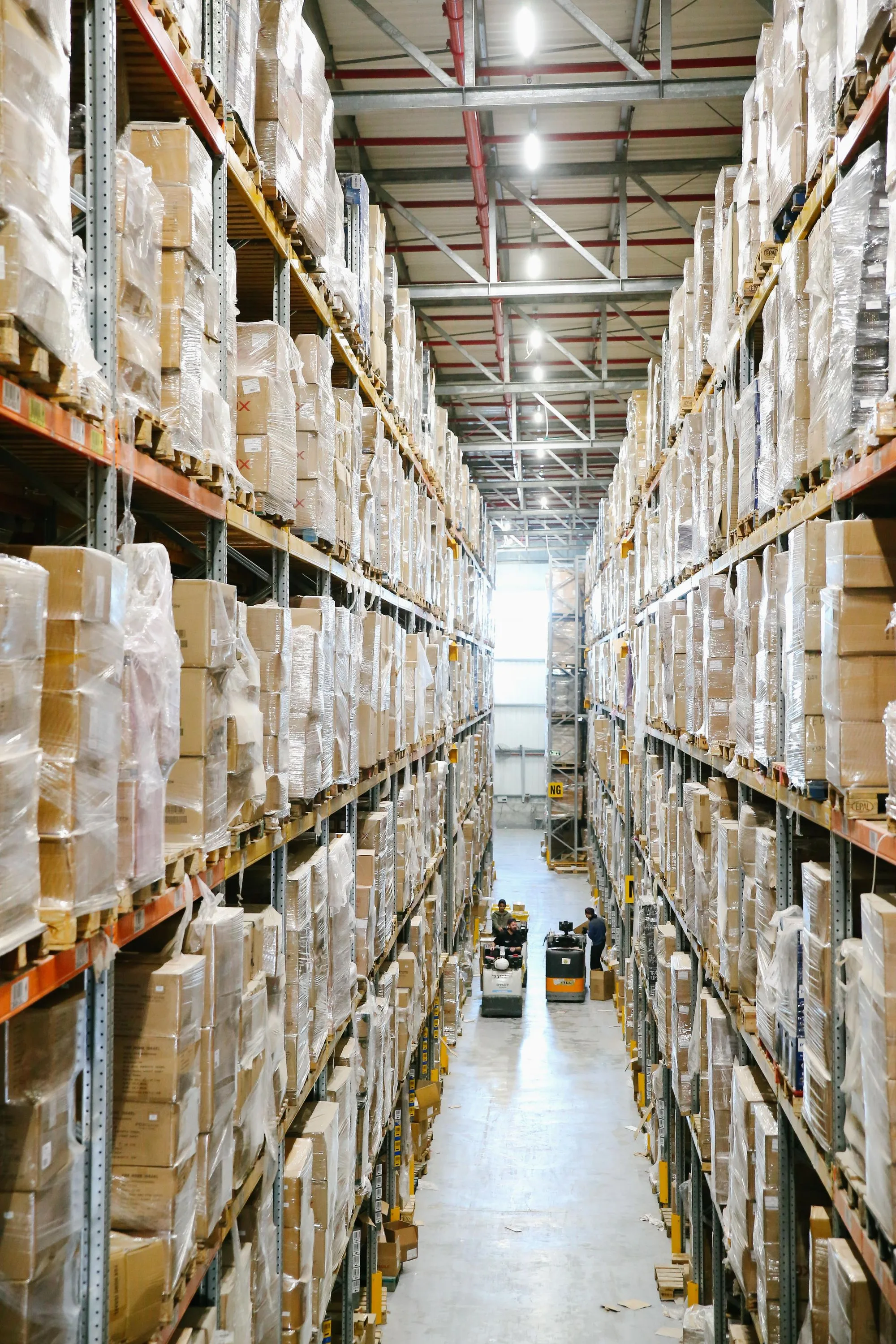 Tall warehouse aisle filled with wrapped pallet loads