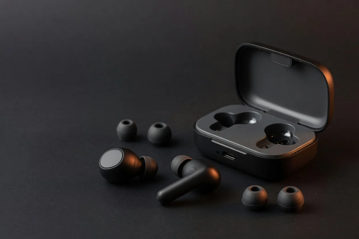 Matte black true wireless earbuds with charging case